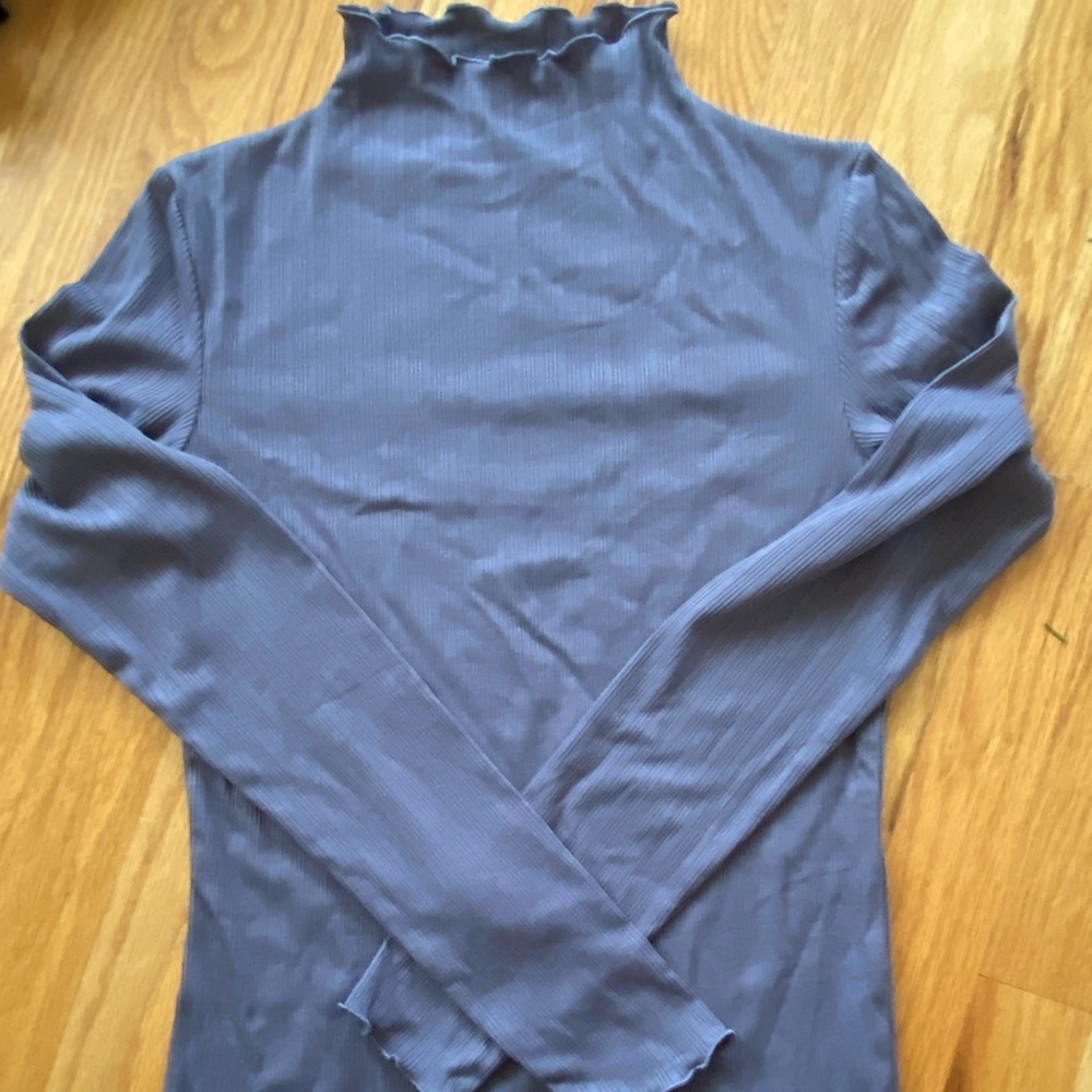 Grey mock neck top with lettuce edges